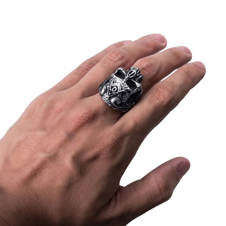 Gothic Masonic skull ring worn on middle finger demonstrating fit and aged silver metal finish in natural hand setting