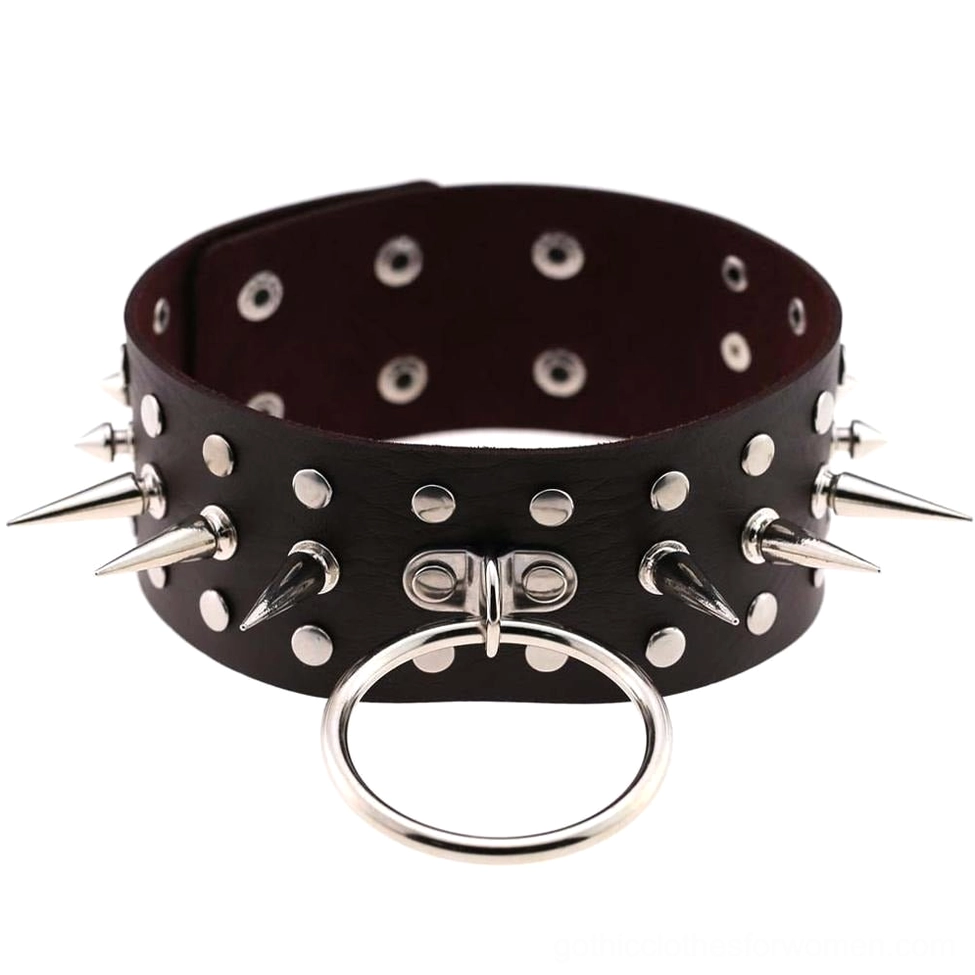 Matte black spiked leather choker necklace with universal spike and O-ring design flat lay on white background