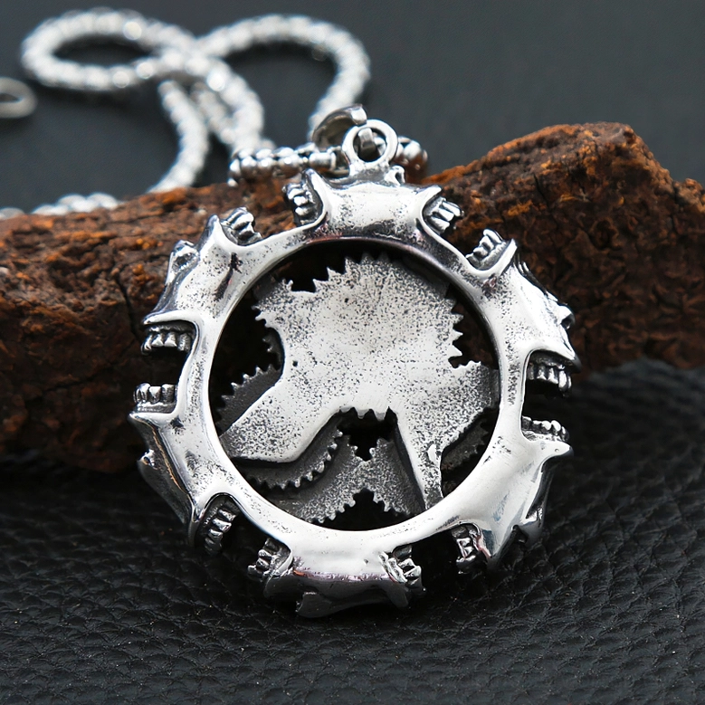 Back side of steampunk gothic pendant displaying solid carved gear backplate on leather mat