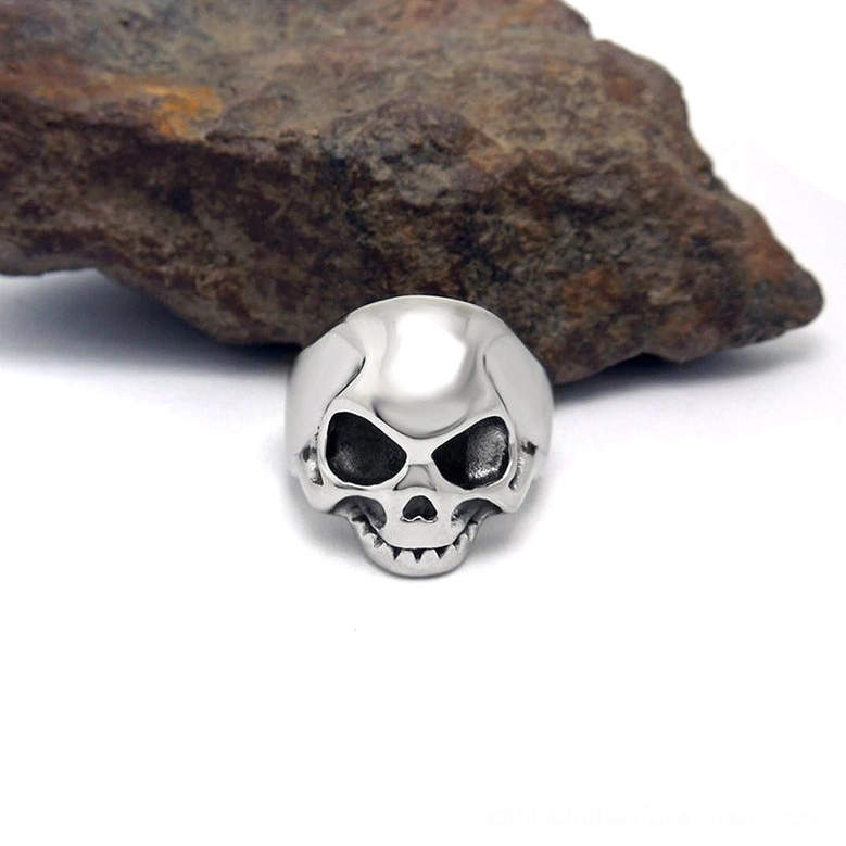 Vintage stainless steel skull signet ring direct front-facing view with complete facial skull details, polished silver tone finish, gothic punk jewelry aesthetic with dark styling prop
