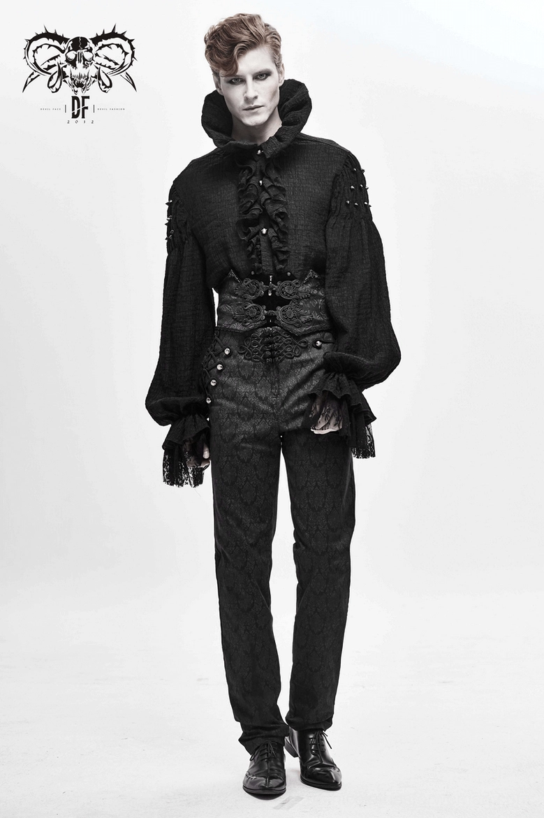 Male model in complete gothic outfit featuring black corset belt with ruffled high collar shirt and brocade trousers