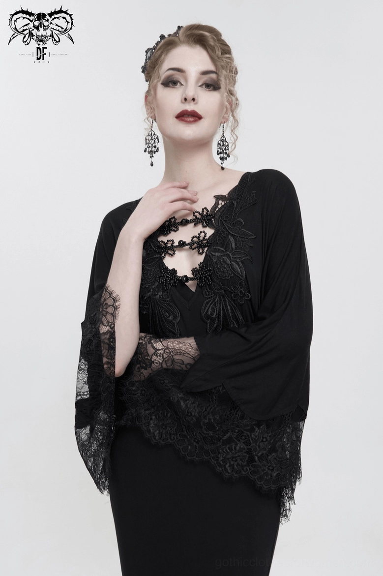 Black mermaid dress sleeve detail, displaying lace-trimmed cape construction with intricate fringed edging and gothic styling