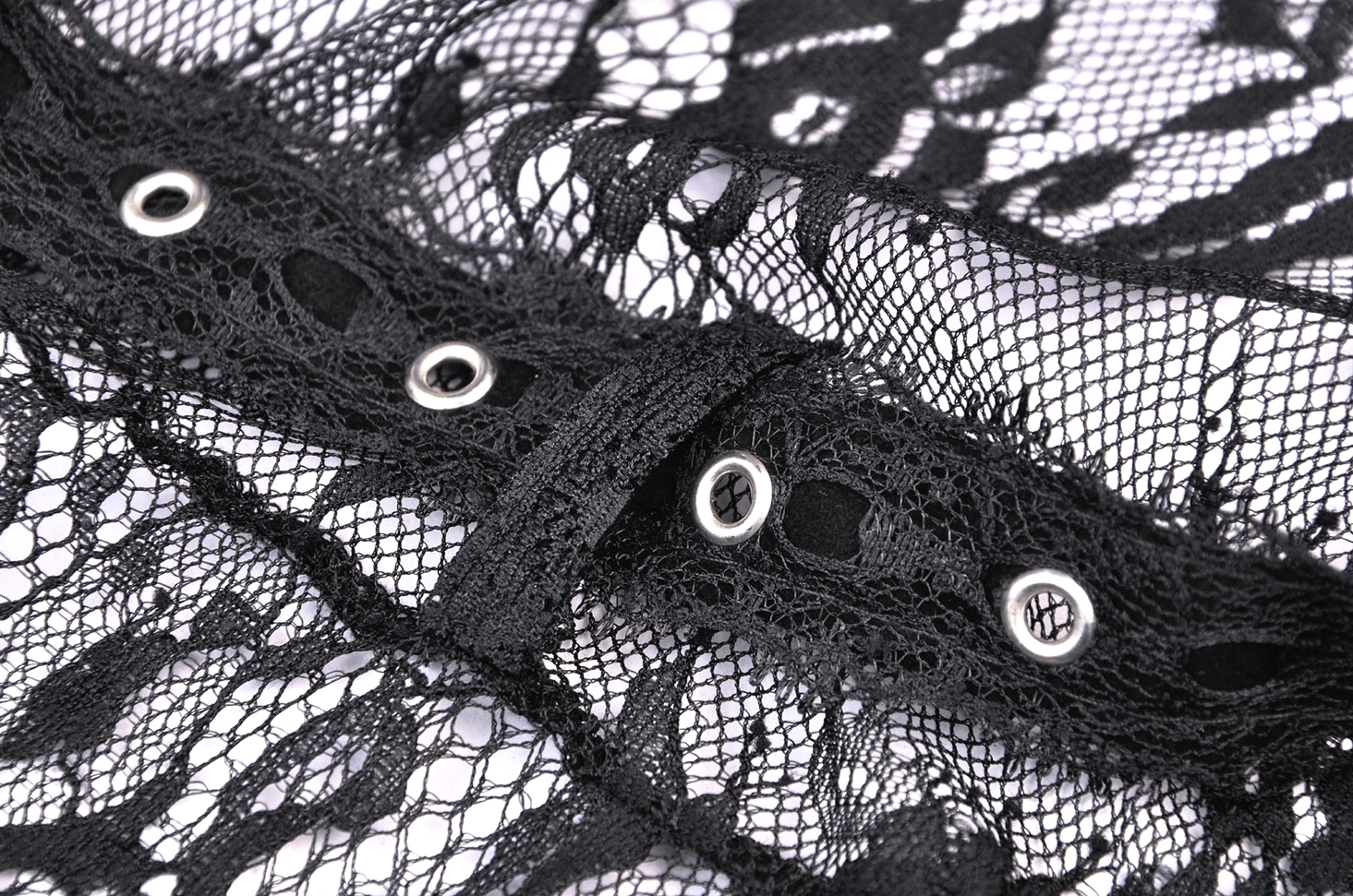 Metal eyelet waist strap fastener on black lace gothic cape - close-up detail