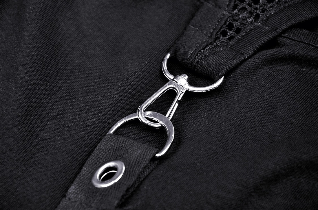 Metal O-ring hardware and eyelet fastener details on black gothic crop top, close-up view