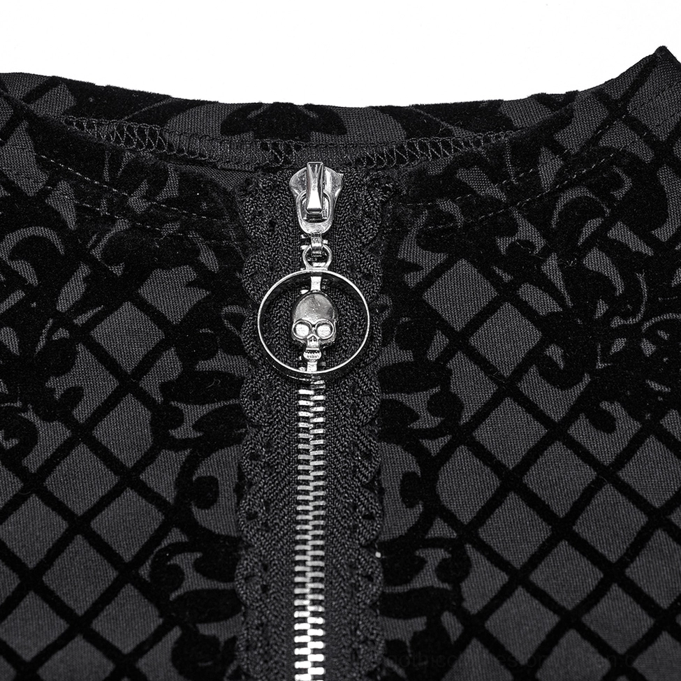 Close-up of silver metal skull zipper puller on gothic crop jacket with metallic detail
