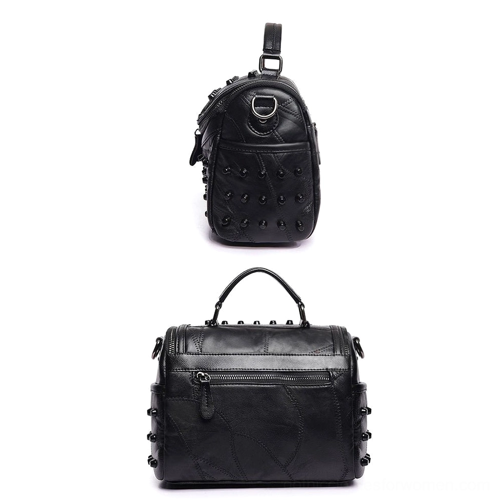 Mini studded leather crossbody bag with side sling configuration and rivet decoration, front side view showing compact gothic messenger design