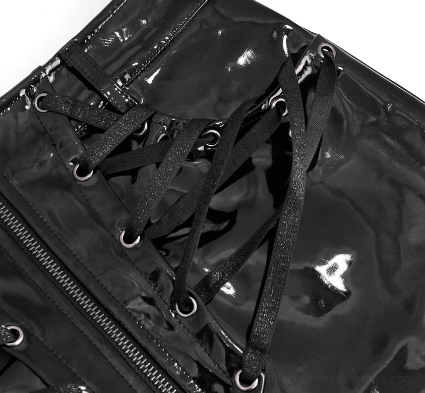 Detailed close-up of black mini skirt front lace-up and central zipper, showing metal grommets and shiny patent leather finish