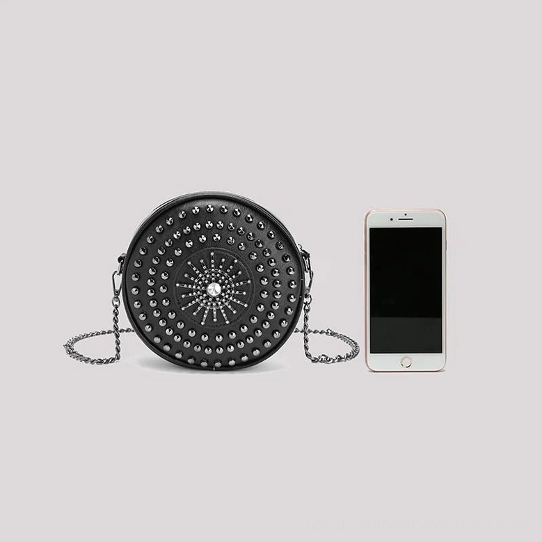 Compact studded circular gothic bag size reference compared with smartphone
