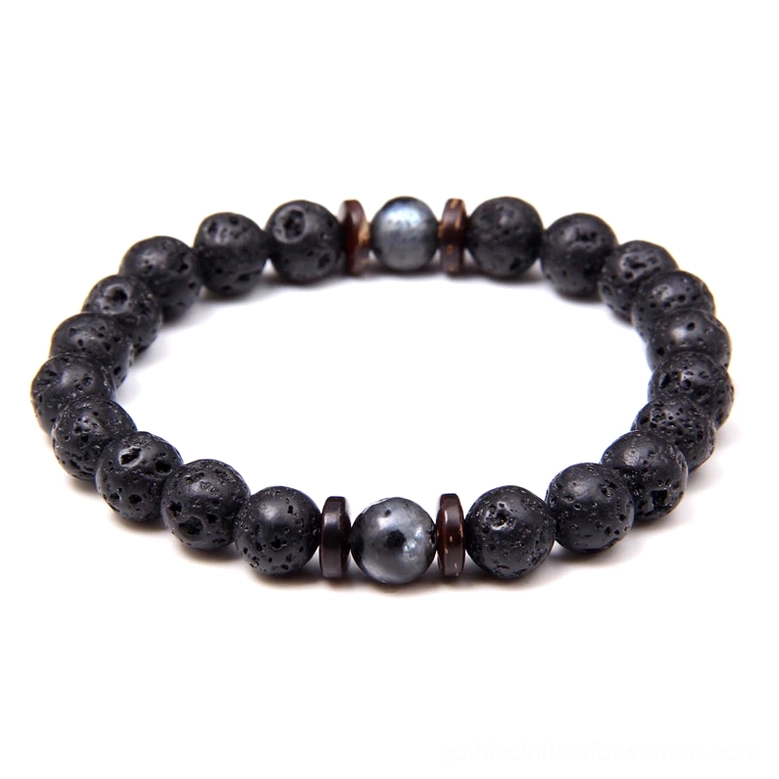 Mixed beaded bracelet featuring lava stone black stone and wooden beads combined flat lay dark alternative jewelry
