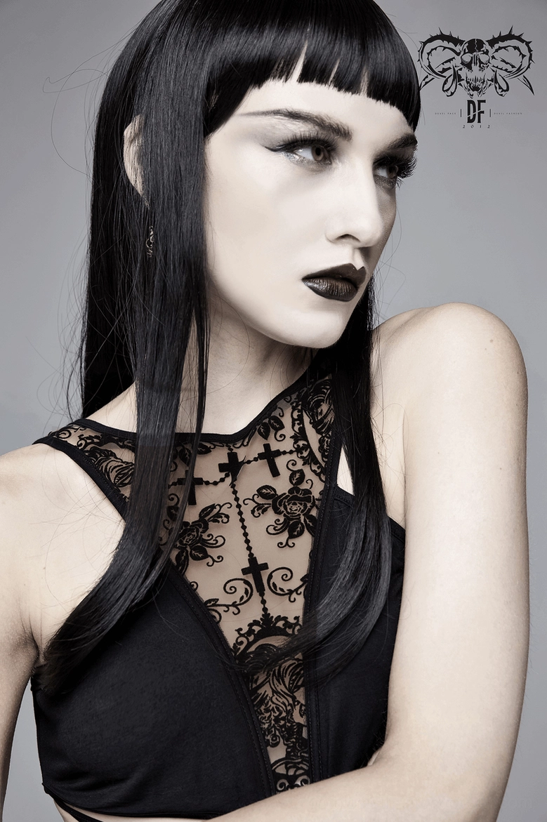 Model wearing gothic vintage dress - upper body and lace neckline detail with cross print