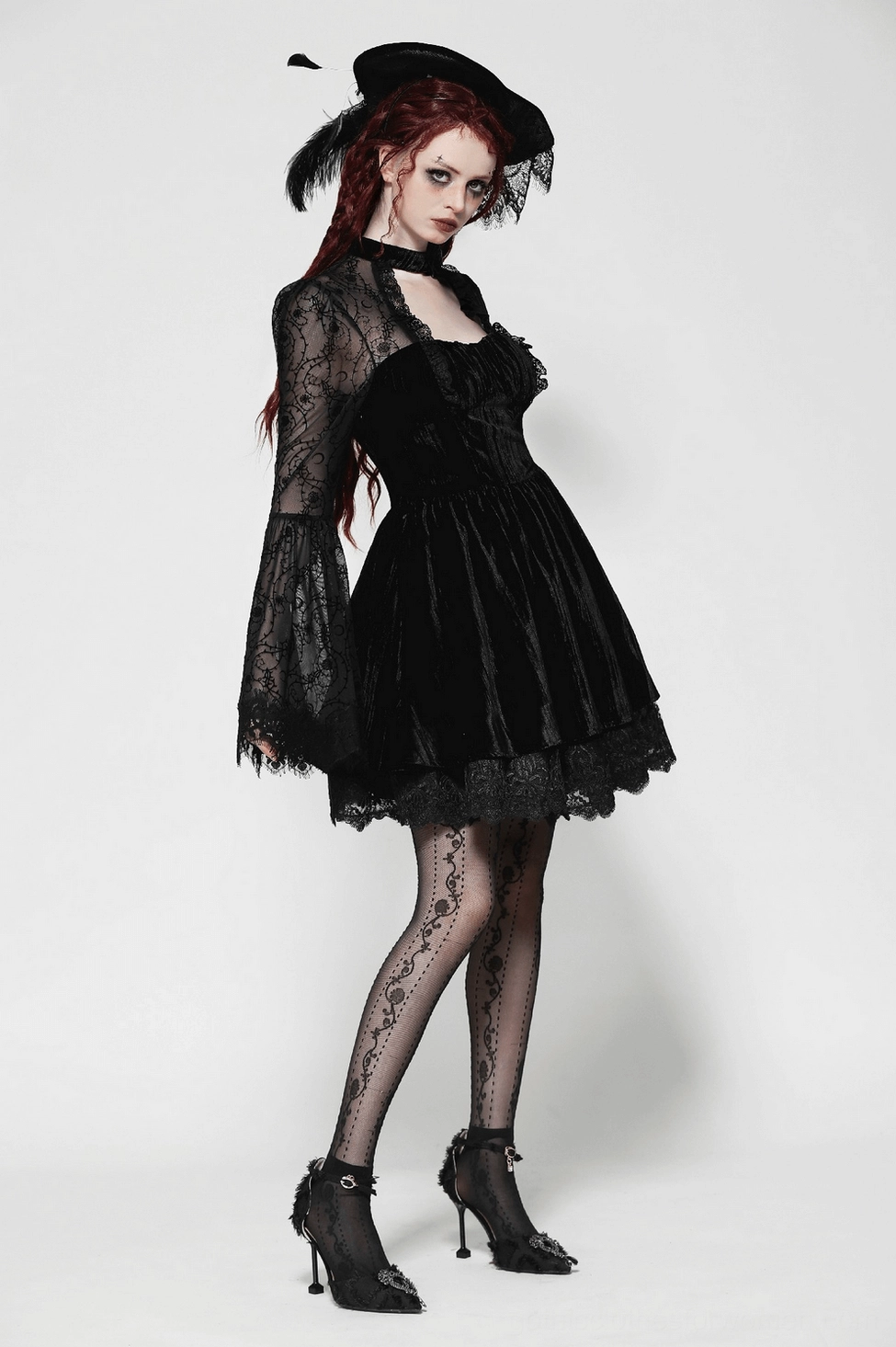 Model wearing Victorian gothic lace dress with sweetheart neckline and dramatic bell sleeves