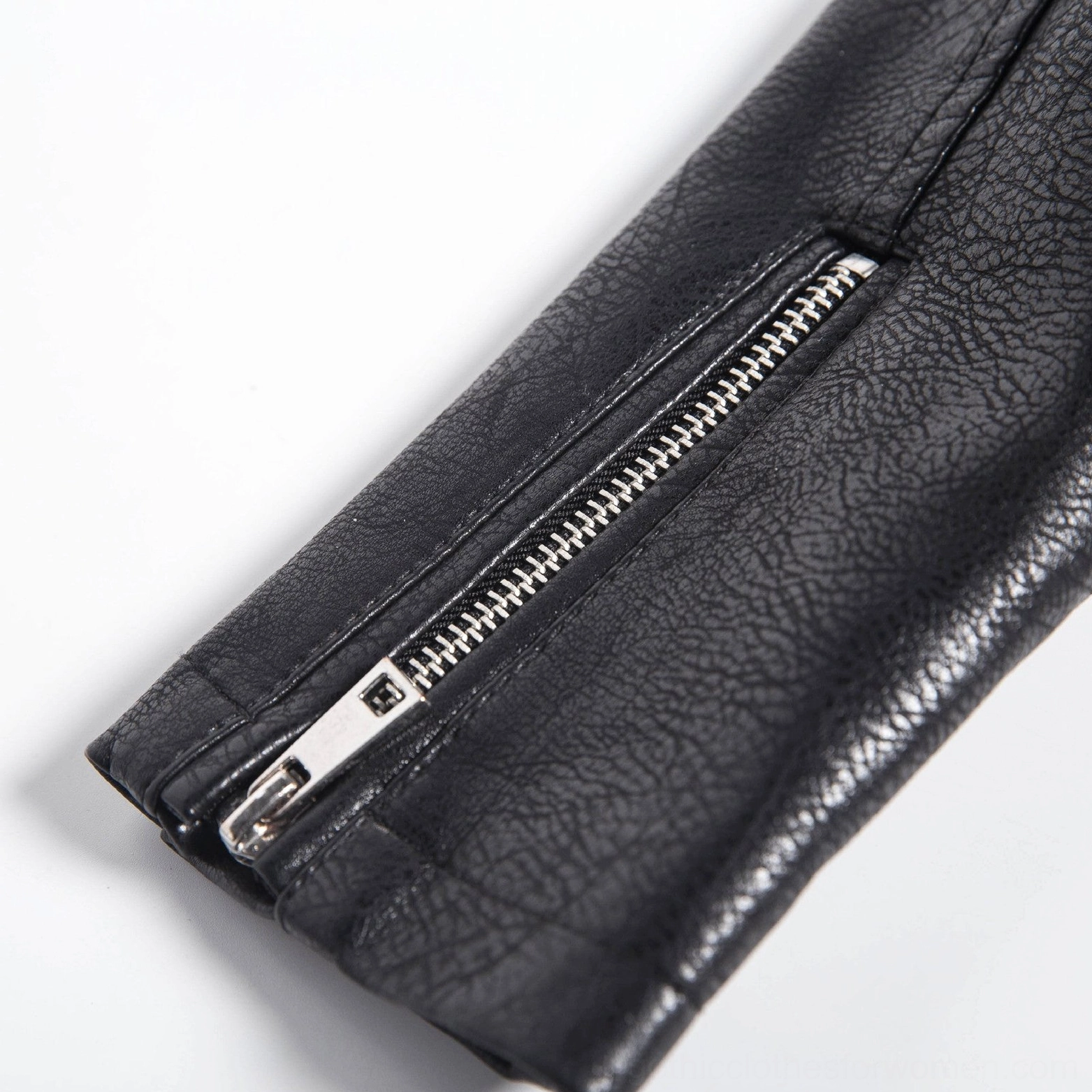Black faux leather jacket side profile showing sleeve length shoulder construction and overall fitted cut