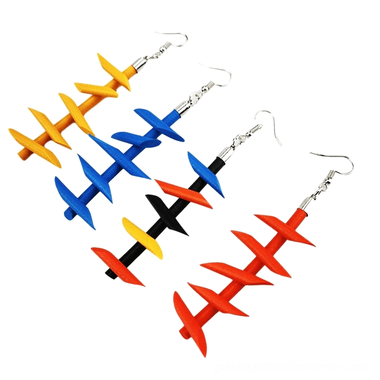 Multiple twisted spike rubber dangle earrings gothic jewelry four pairs varied color combinations flat lay display