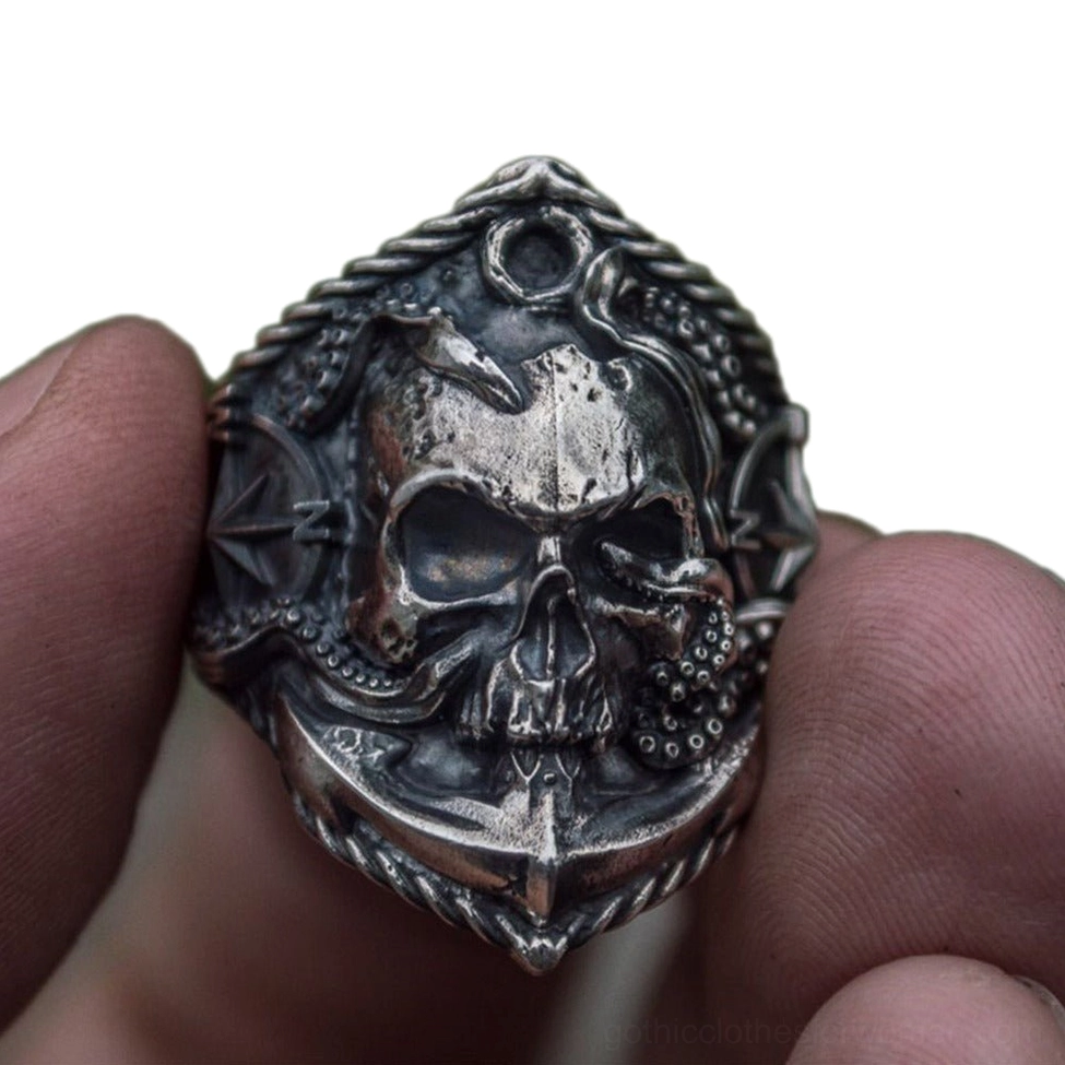 Nautical skull biker ring worn on hand – front view displaying rope frame, skull and anchor design with dark oxidized finish