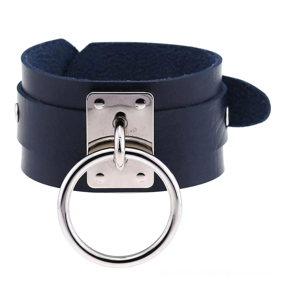 Navy blue leather gothic wrist cuff bracelet showing metal ring hardware detail, unisex design