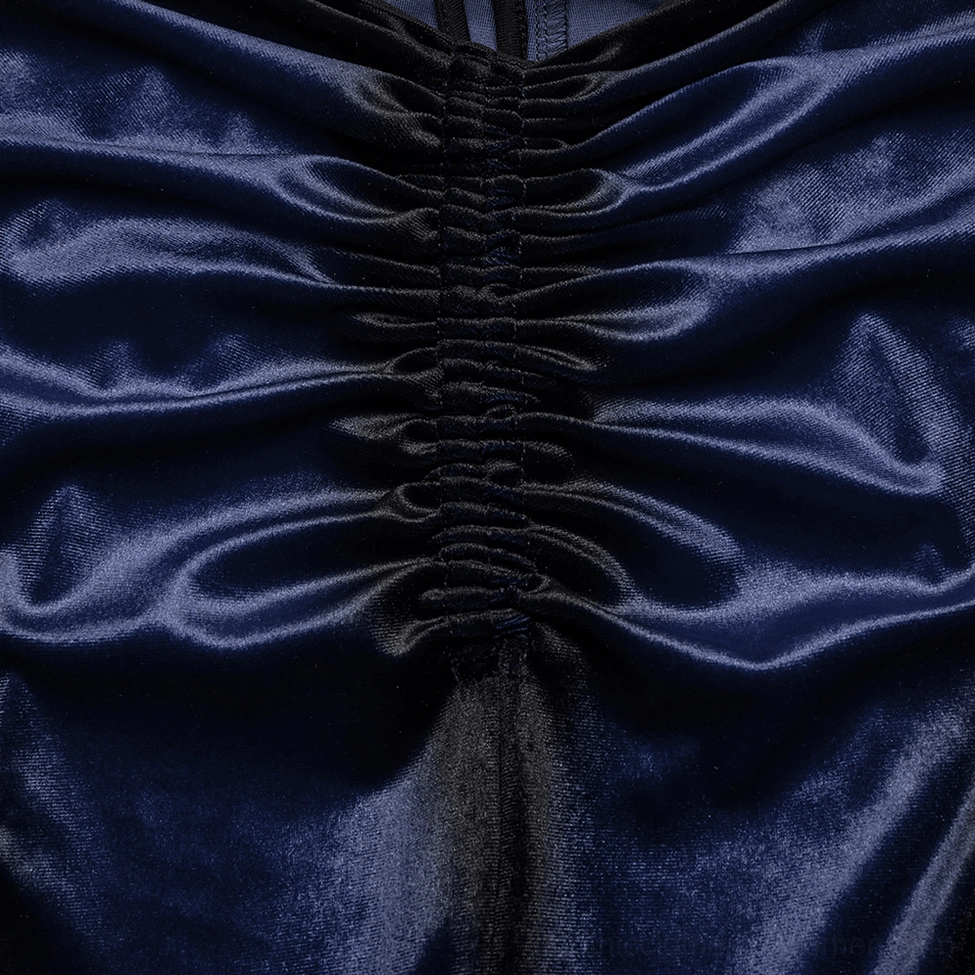 Close-up front detail of ruched drawstring and glossy navy velvet texture on gothic flare pants