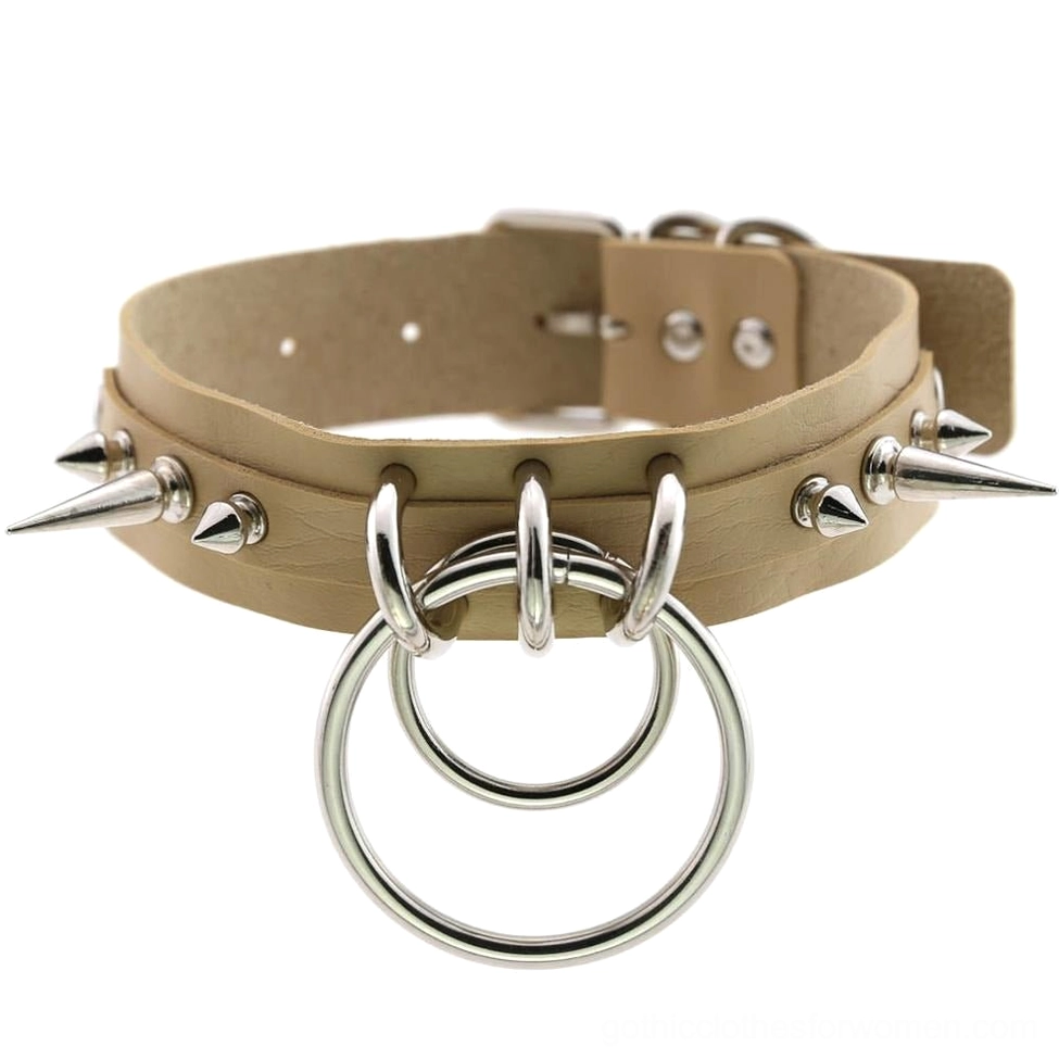 Nude beige spiked leather choker with silver metal spike decorations, dual O-rings, and adjustable buckle system