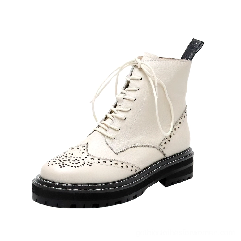 Off-white cream leather gothic brogue ankle boots with black chunky sole and matching laces, three-quarter view