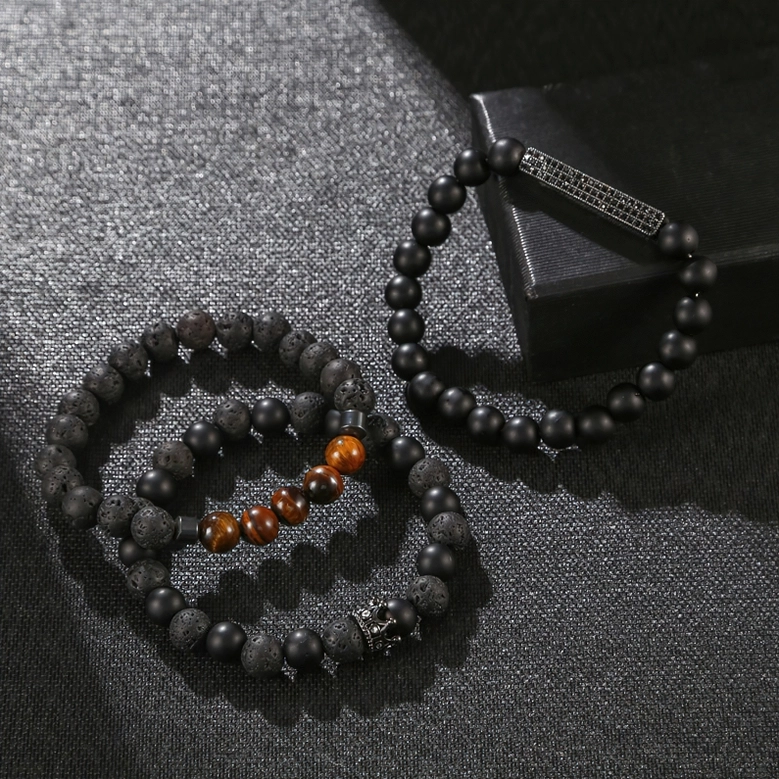 Black onyx gothic beaded bracelet with vintage crown ornament and tiger eye stones displayed with gift box packaging
