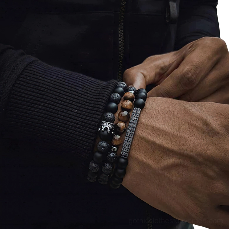 Black matte onyx beads gothic bracelet with crown and metal bar accents on dark skin tone wrist, adjusting detail