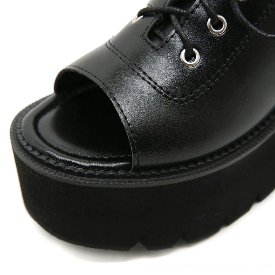 Close-up of open toe section with stitched leather trim detail on platform gothic sandal