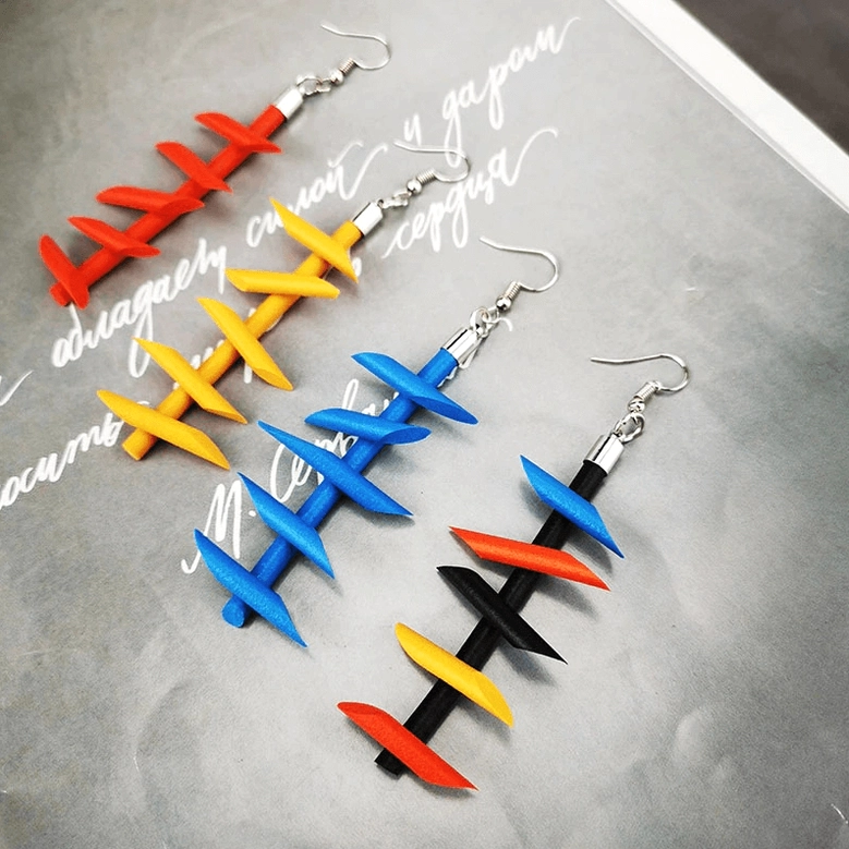 Orange twisted spike rubber dangle earrings gothic punk jewelry detailed close-up view handmade silicone