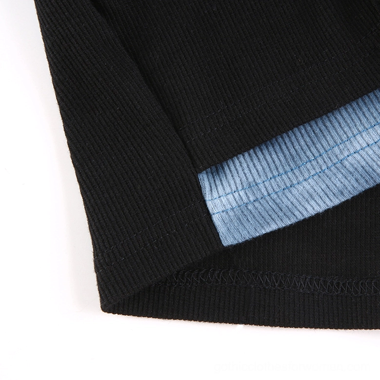 Patchwork crop top layered construction detail, demonstrating two-piece design and fitted long sleeve base layer