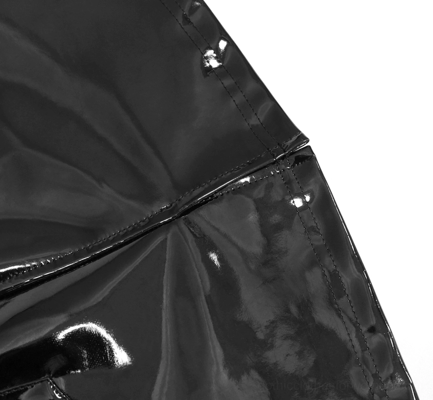 Detailed view of black patent leather mini skirt fabric texture showing smooth glossy surface and visible stitch lines