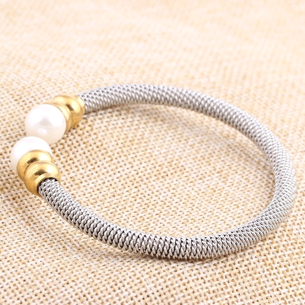 Adjustable open cuff design of victorian pearl bracelet shown in close-up for sizing reference