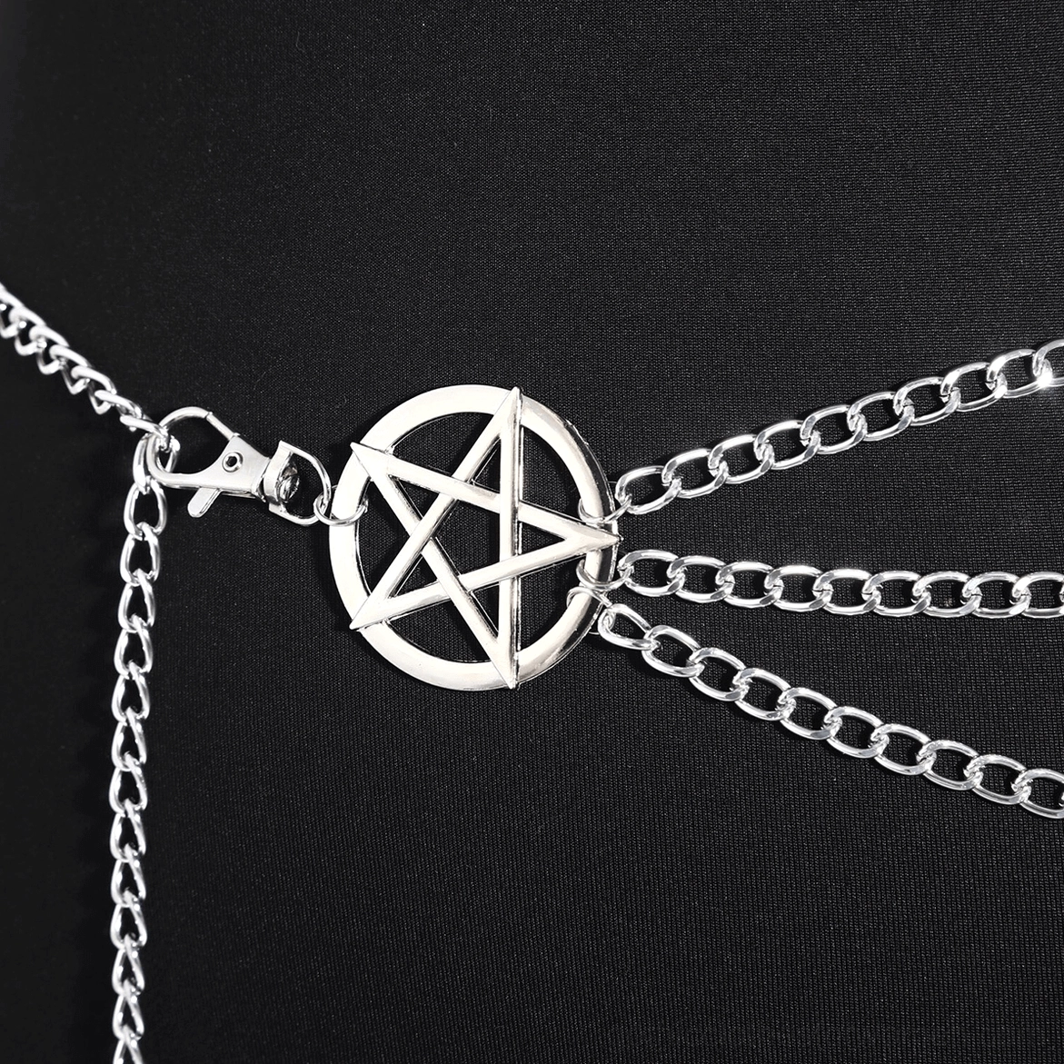 Close-up detail of pentagram waist chain belt showing lobster claw clasp and central pentagram buckle on black mannequin