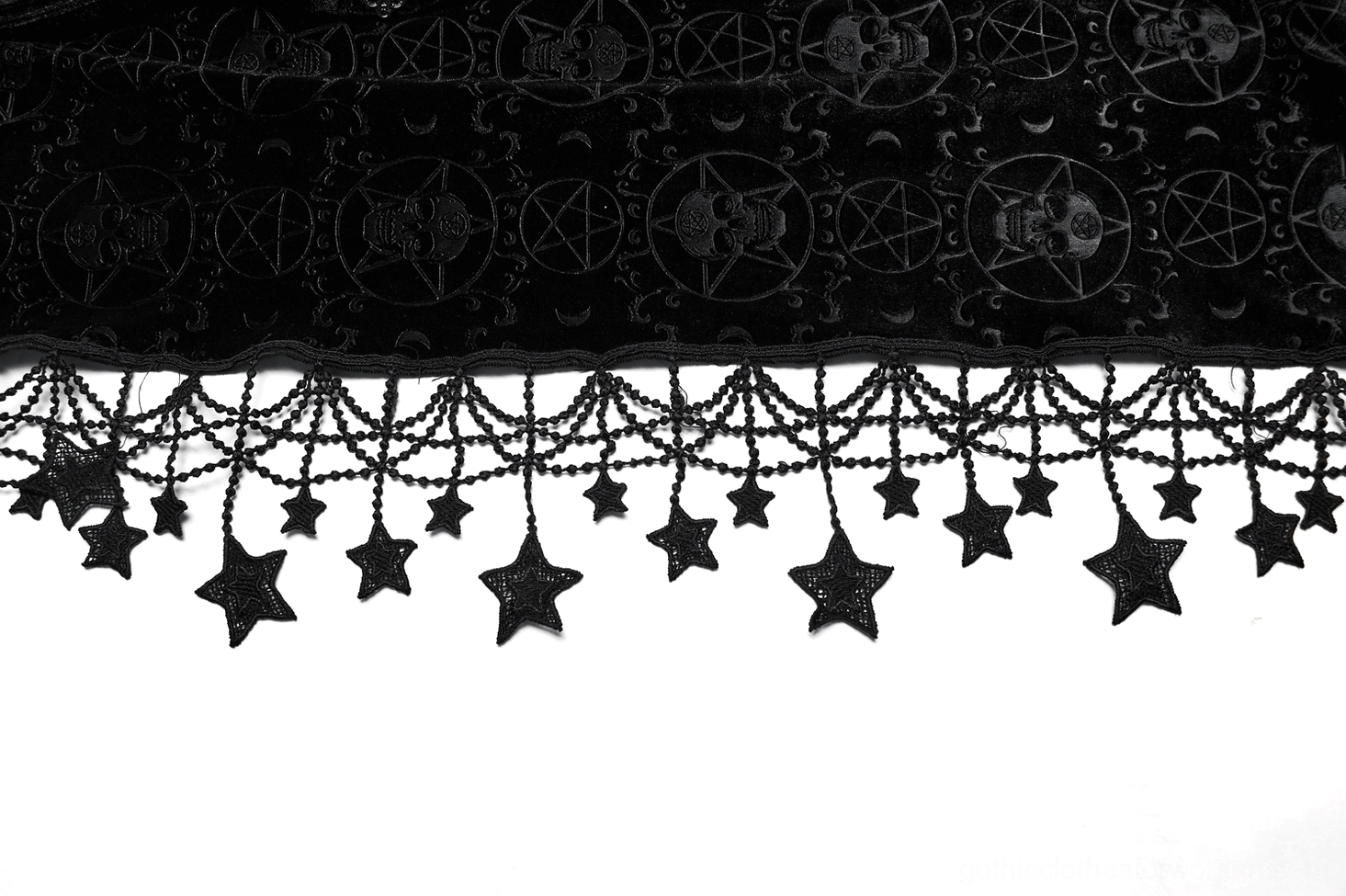 Close-up detail of star tassel trim and chain link border on pentagram cape hem