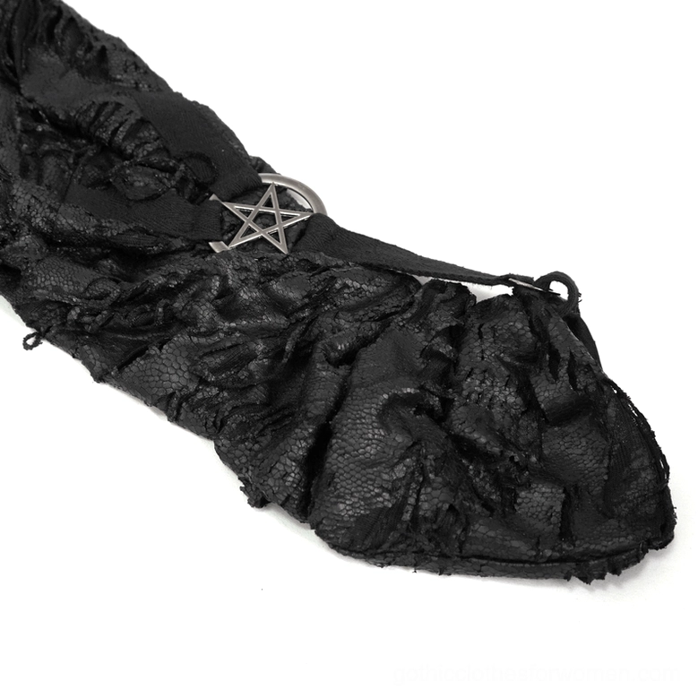 Close-up macro detail of silver pentagram metal hardware ring and frayed black textured fabric