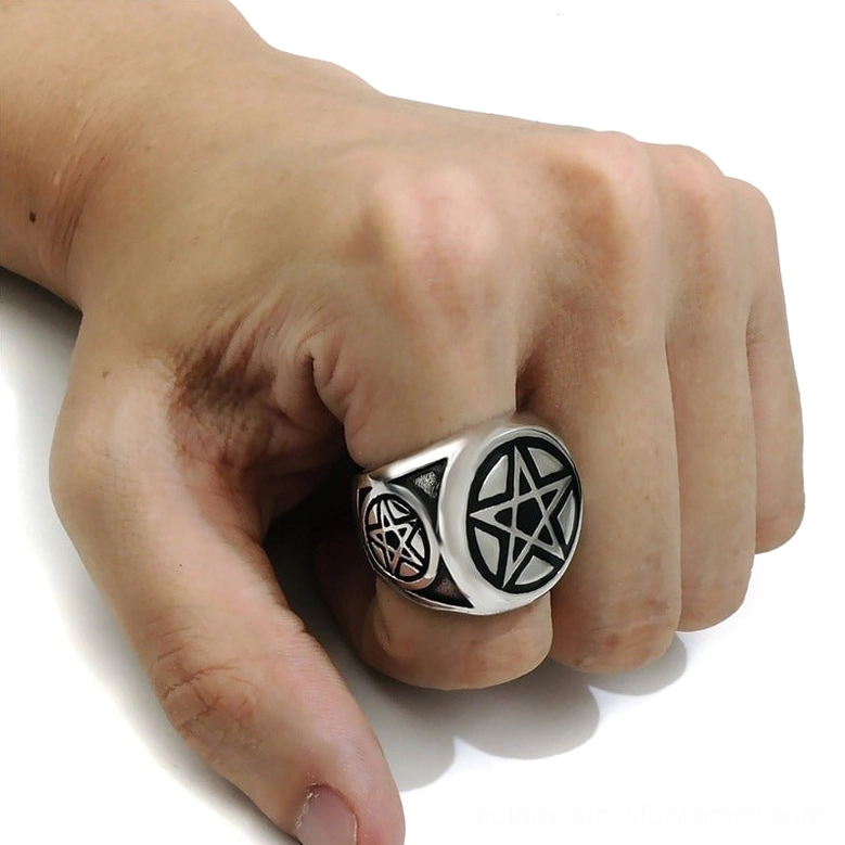 Pentagram ring worn on male hand middle finger side overhead view showing side pentagram detail