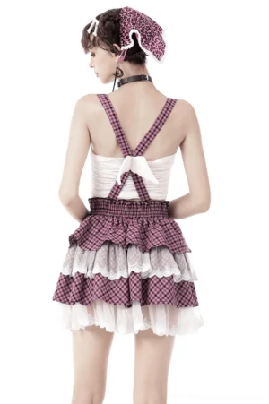 Pink gothic suspender skirt back view showing cross straps with angel wing decoration