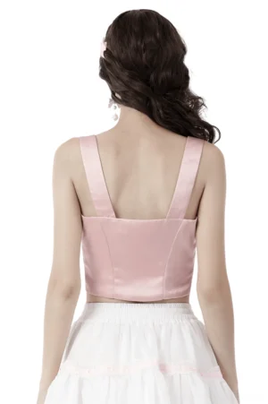 Pink gothic bustier top back view showing wide satin shoulder straps and cropped slim fit silhouette on model