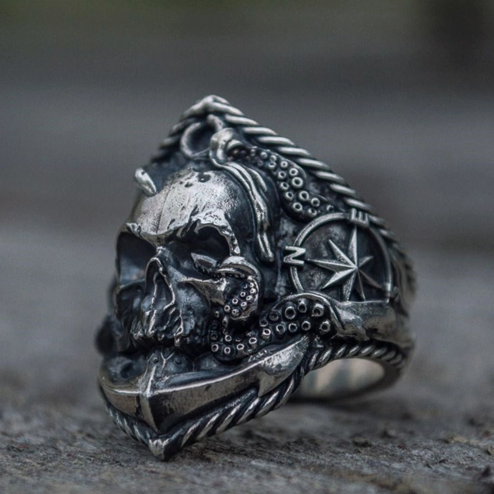 Pirate skull compass ring featuring octopus tentacles, compass and twisted rope trim with vintage silver patina
