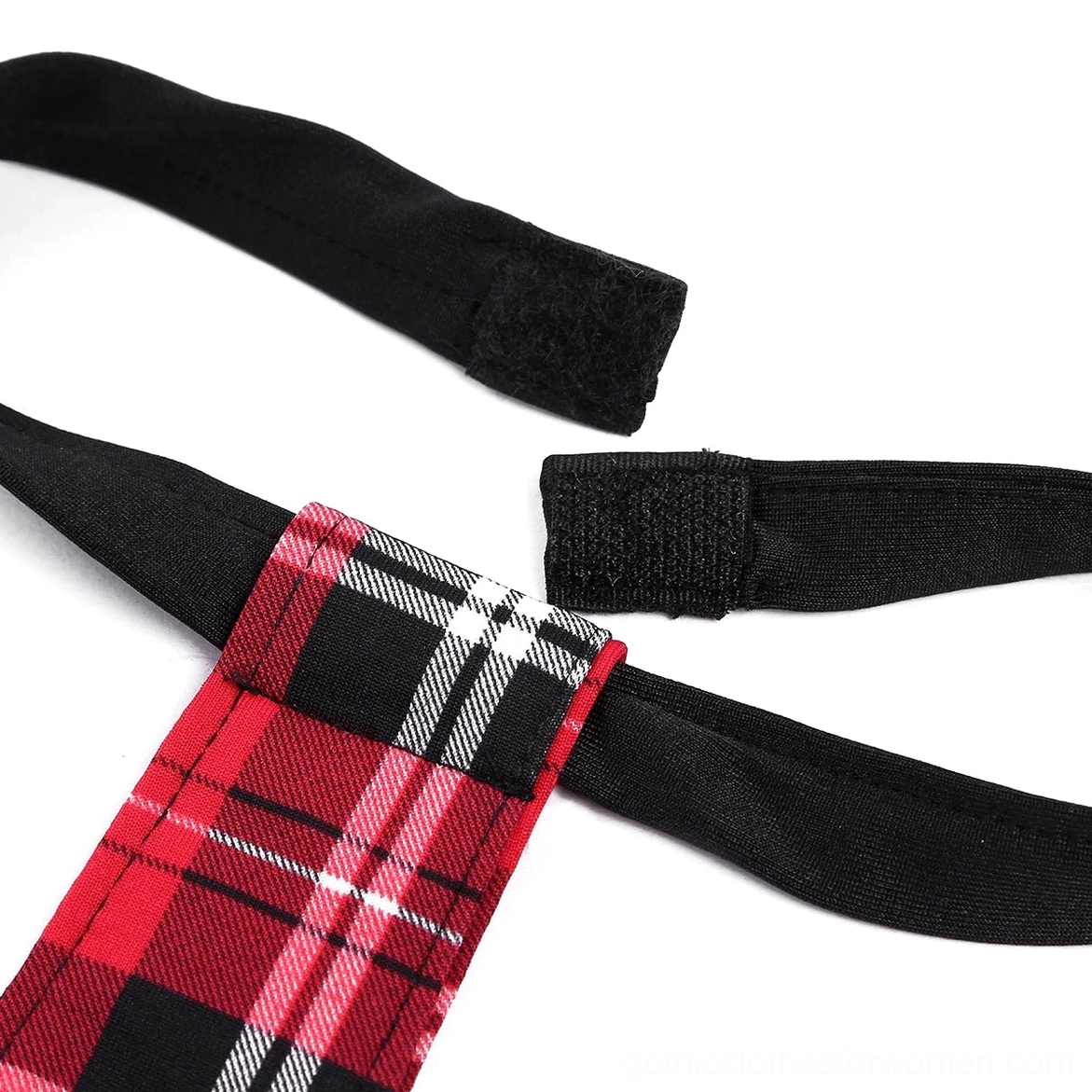 Gothic schoolgirl costume necktie velcro fastener close-up showing plaid fabric and elastic attachment