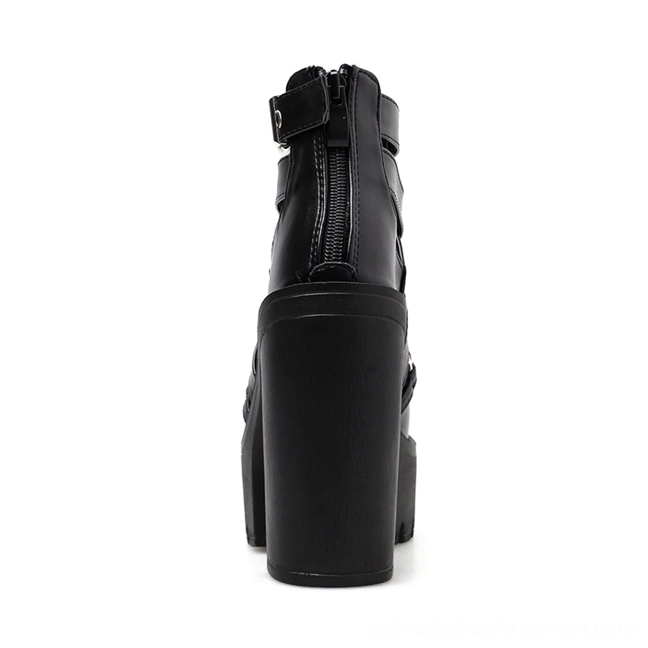 Women's platform boots rear view showing waterproof rubber sole and rear zipper closure mechanism
