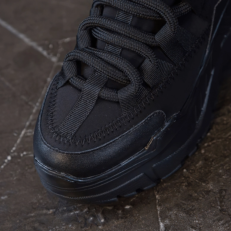 Platform leather sneaker flex and articulation points showing sole construction