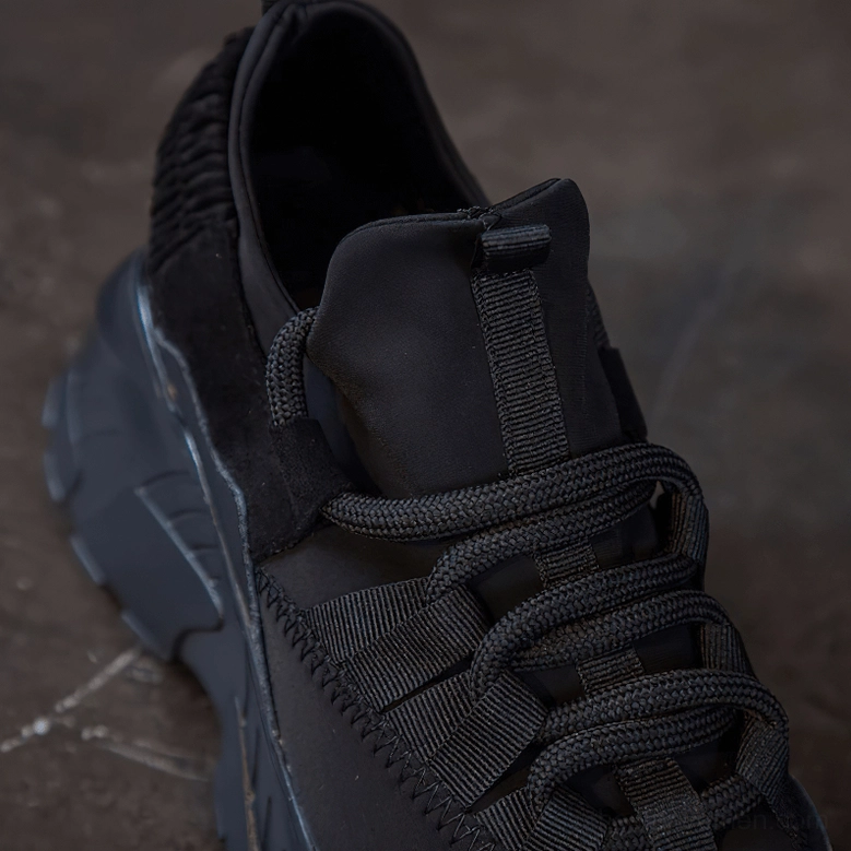 Women's platform sneaker compared to regular shoe showing dramatic height elevation