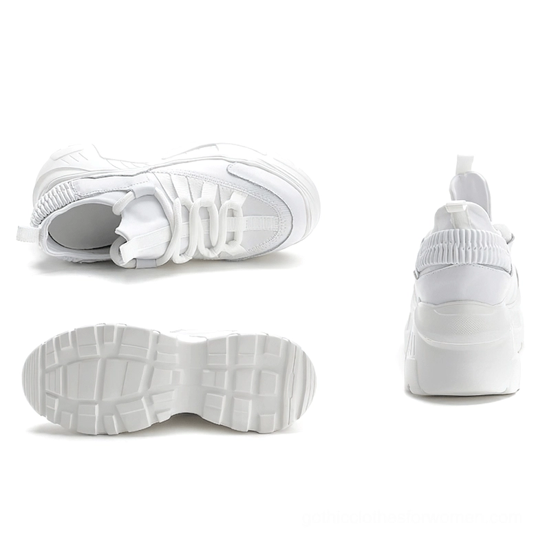 Women's platform leather sneaker detailed view of lace-up closure and textile upper construction