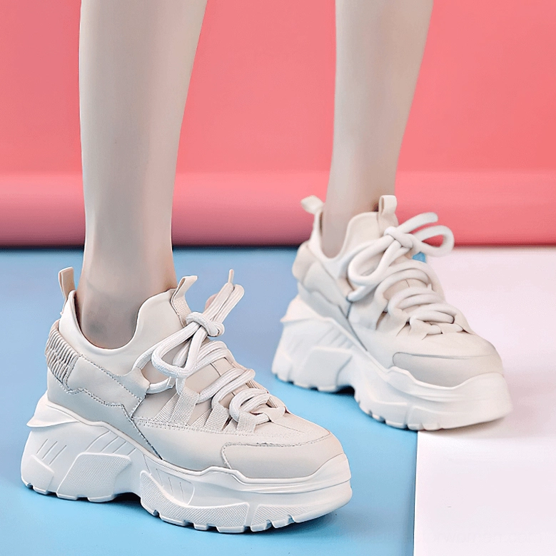 Platform leather sneaker bottom sole close-up showing lug tread pattern and rubber material