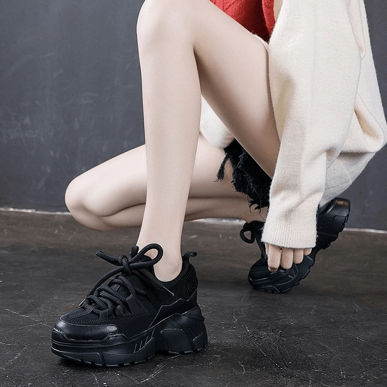 Women's platform leather sneaker close-up of stitching and seam construction quality