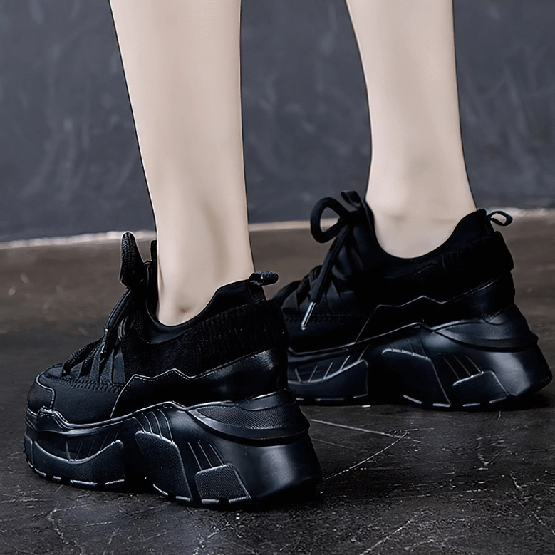 Women's platform sneaker toe box detail showing leather upper and lace-up mechanism