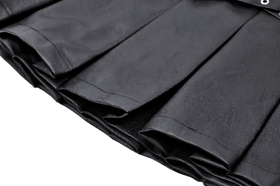 Close-up texture of pleated black faux leather showing precise pleat folding and material surface quality