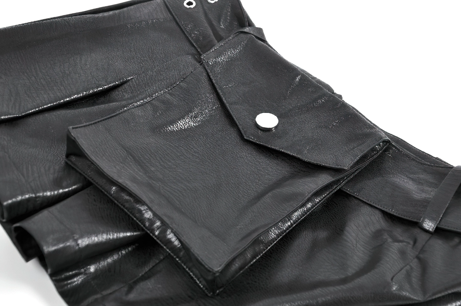 Close-up texture view of pleated faux leather construction and zipper closure on gothic skort