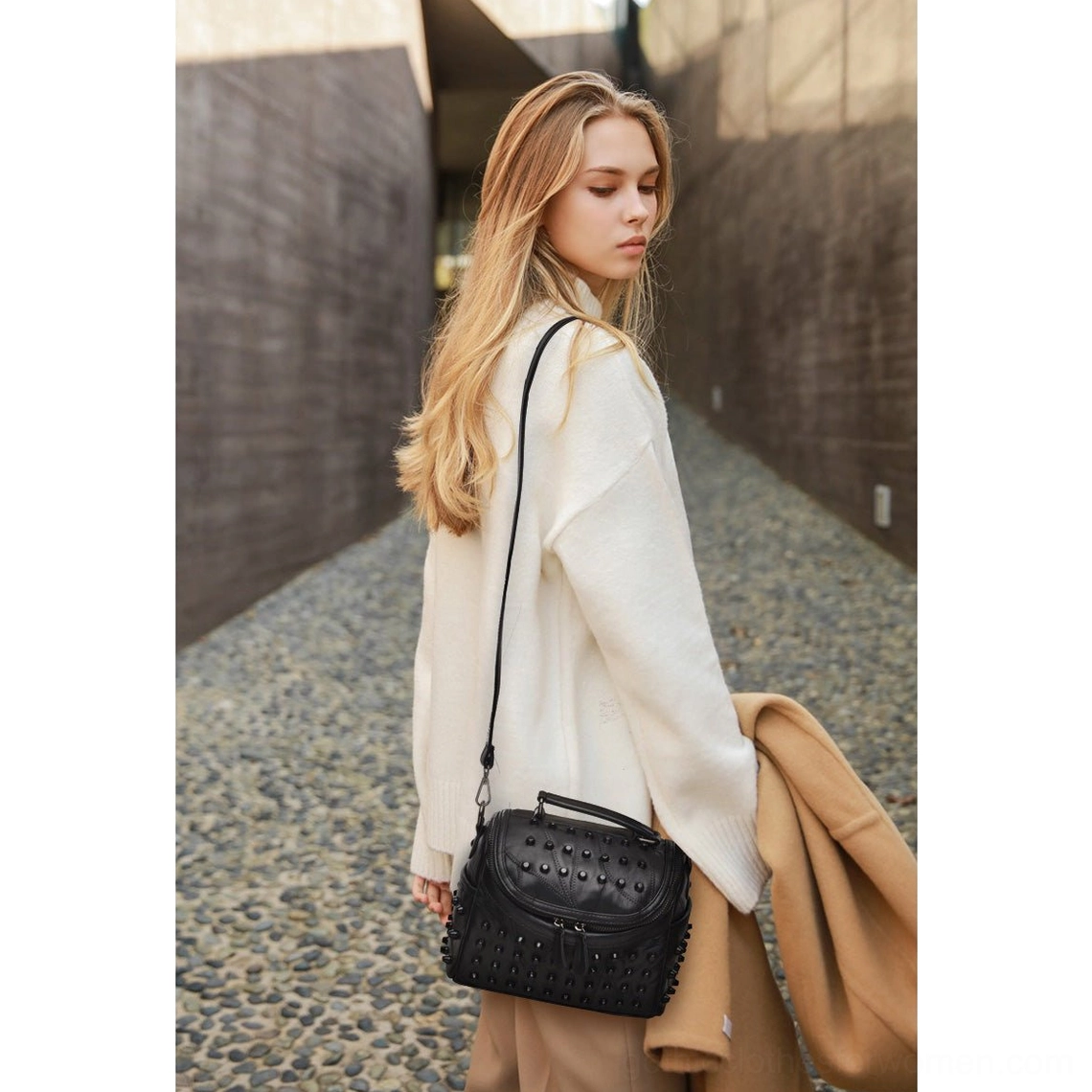 Premium black studded sheepskin leather crossbody bag with removable strap and dual zipper system, perfect for gothic alternative style
