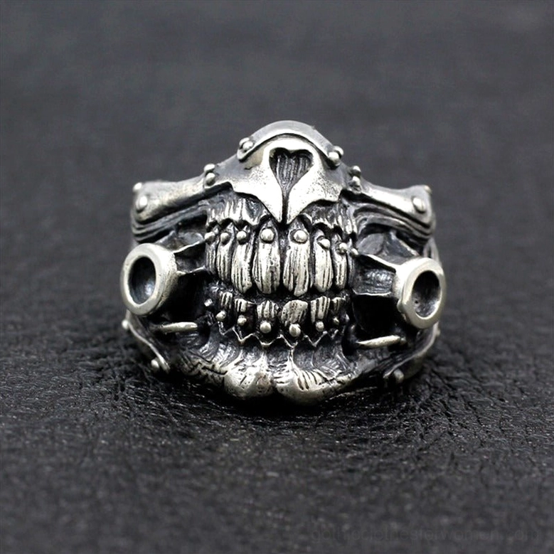 Direct front view of immortan joe inspired punk skull mask ring with theatrical detail