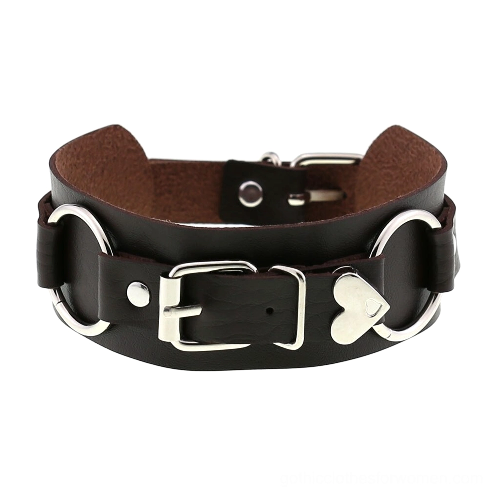 Pure black leather choker collar with bright silver hardware and prominent heart charm detail