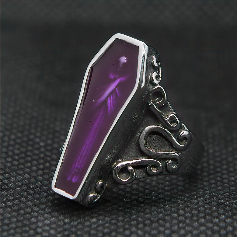 Purple coffin mummy gothic ring side view on black fabric showing vintage scroll carvings and enamel mummy pattern